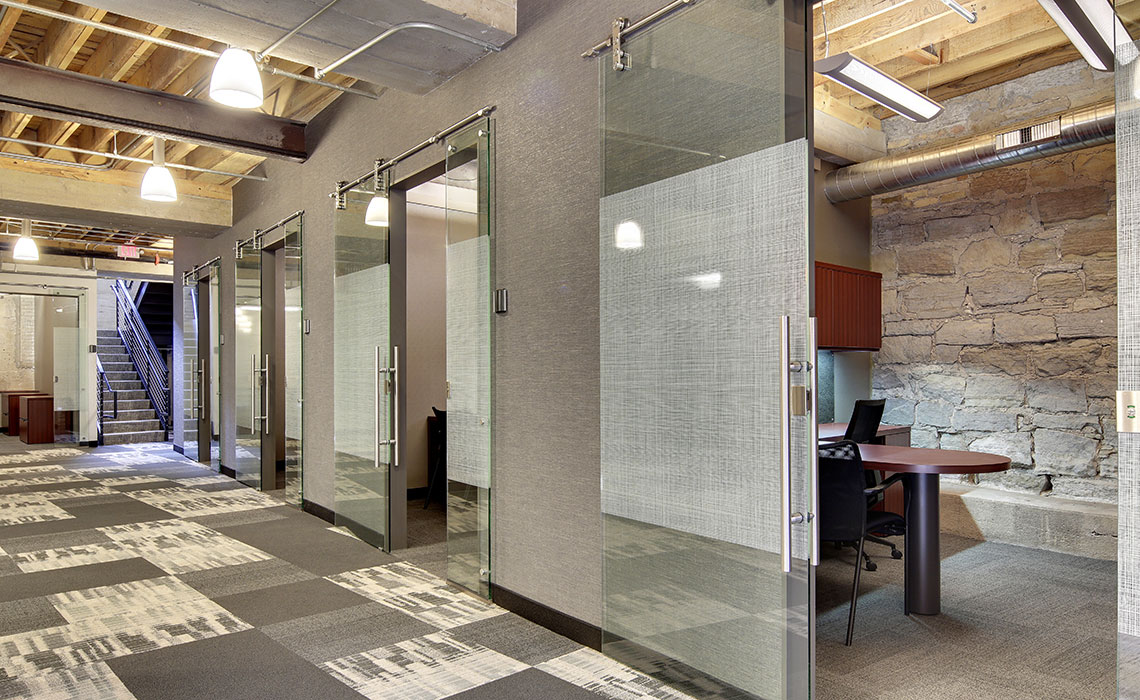 Glass-walled offices for heads-down work a RE/MAX Results in Loring Park