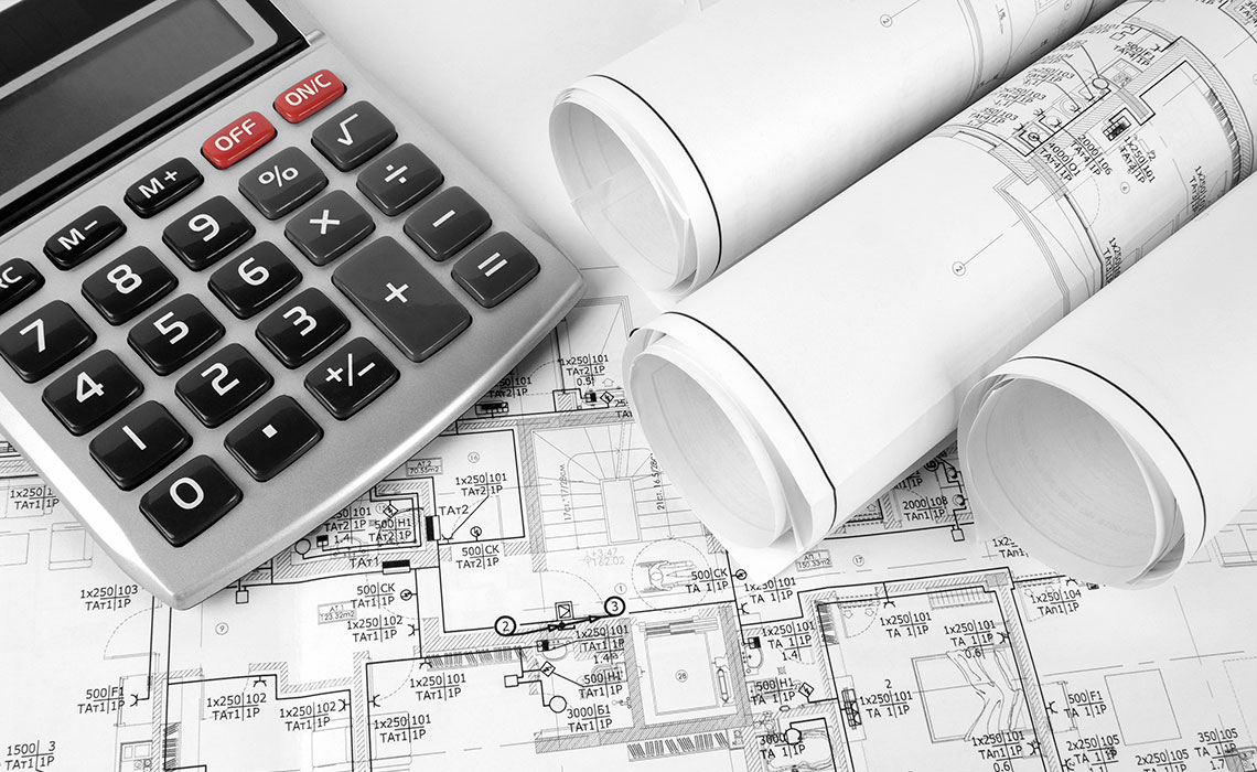 Calculator sitting on construction plans